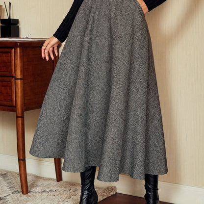 Women's gray A-line midi skirt with a flared hem