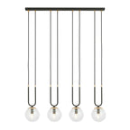 Zwarte hanglamp met vier transparante glazen bollen en goudkleurige details aan een lange plafondbalk