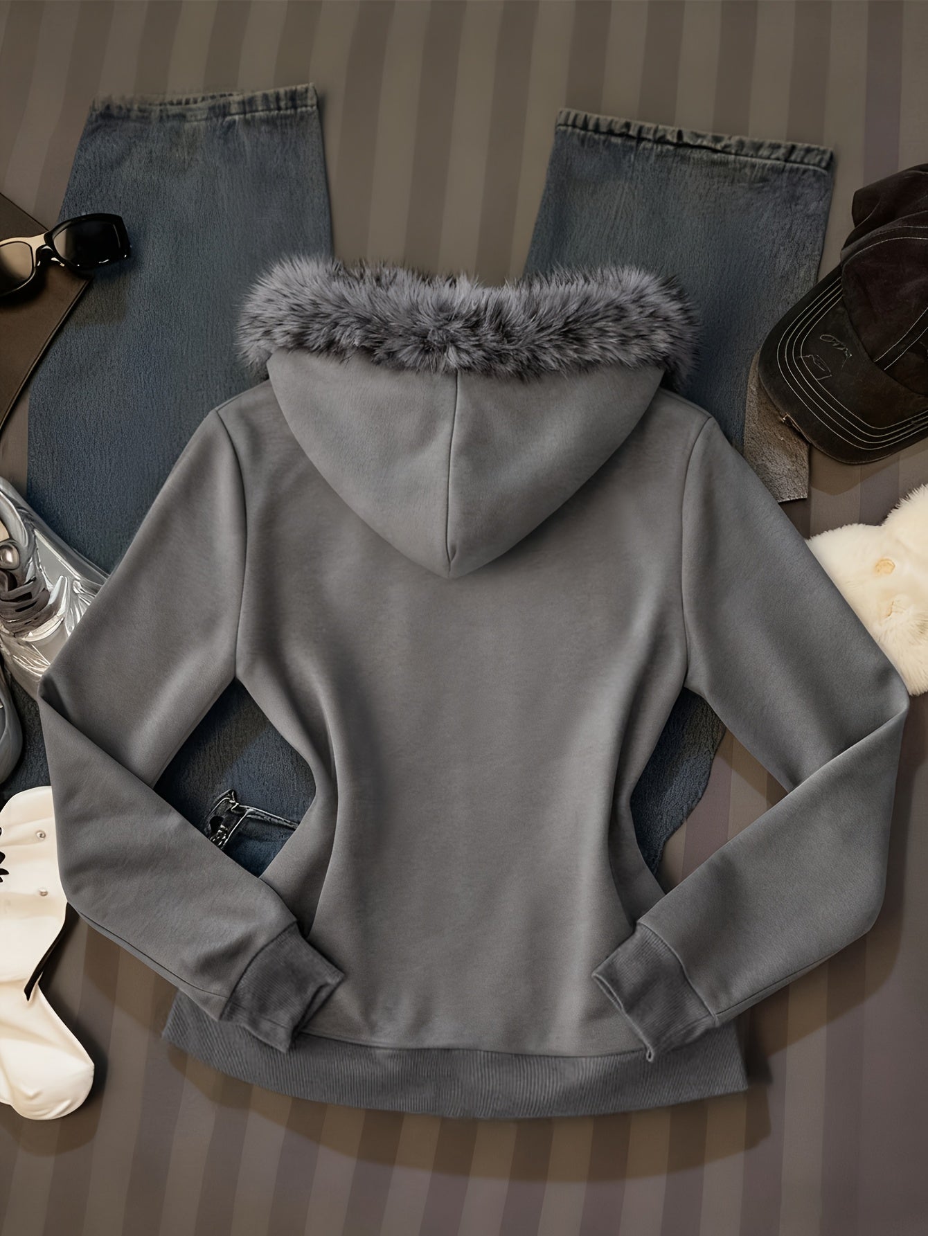 Women's hooded zip-up jacket with faux fur trim and a decorative pattern in gray