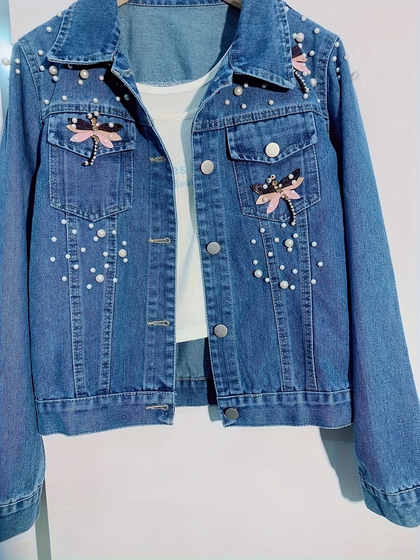 Women's denim jacket with blue pearl embellishments