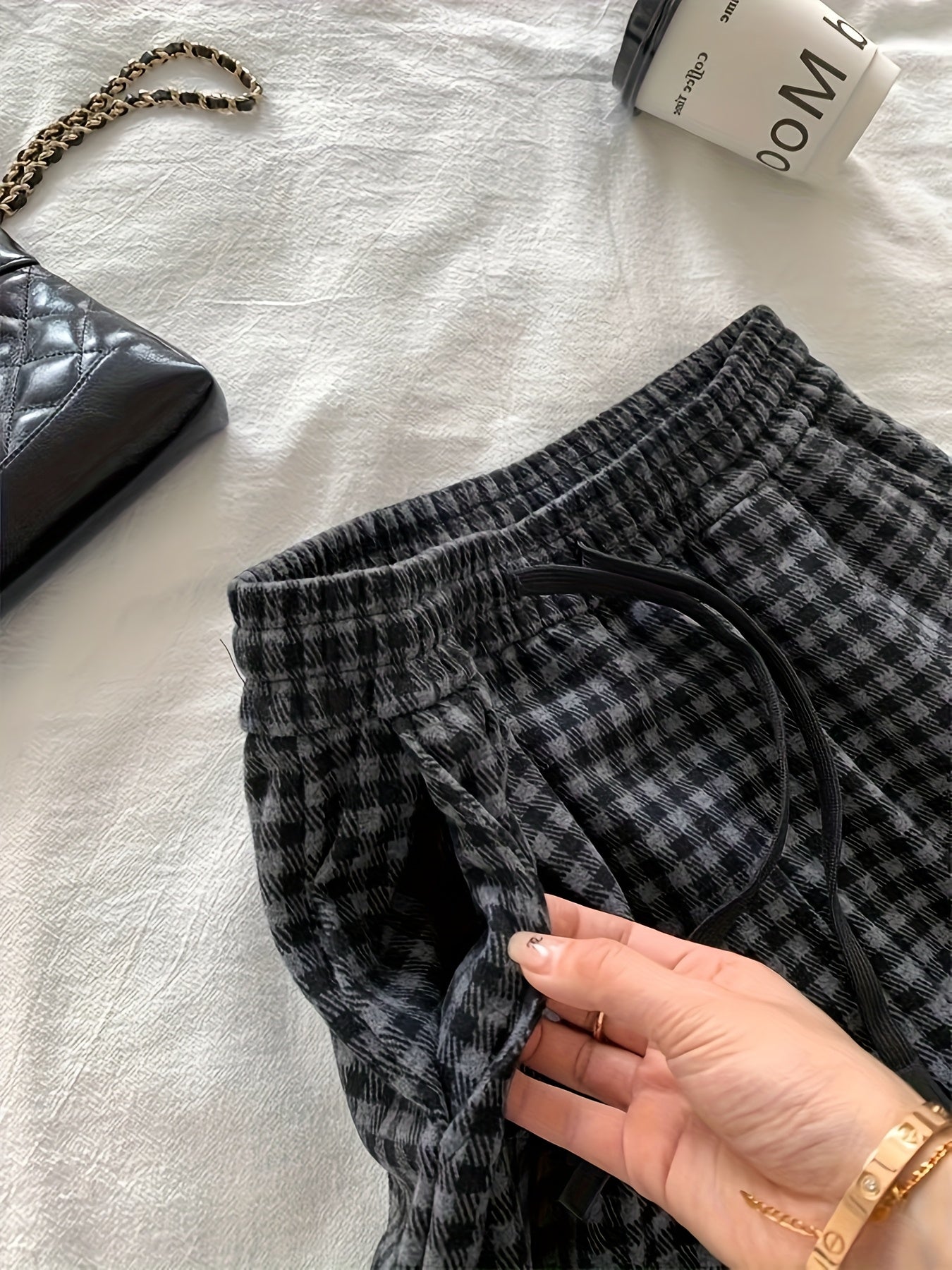 Unisex wide-leg trousers in a gray-and-black gingham pattern
