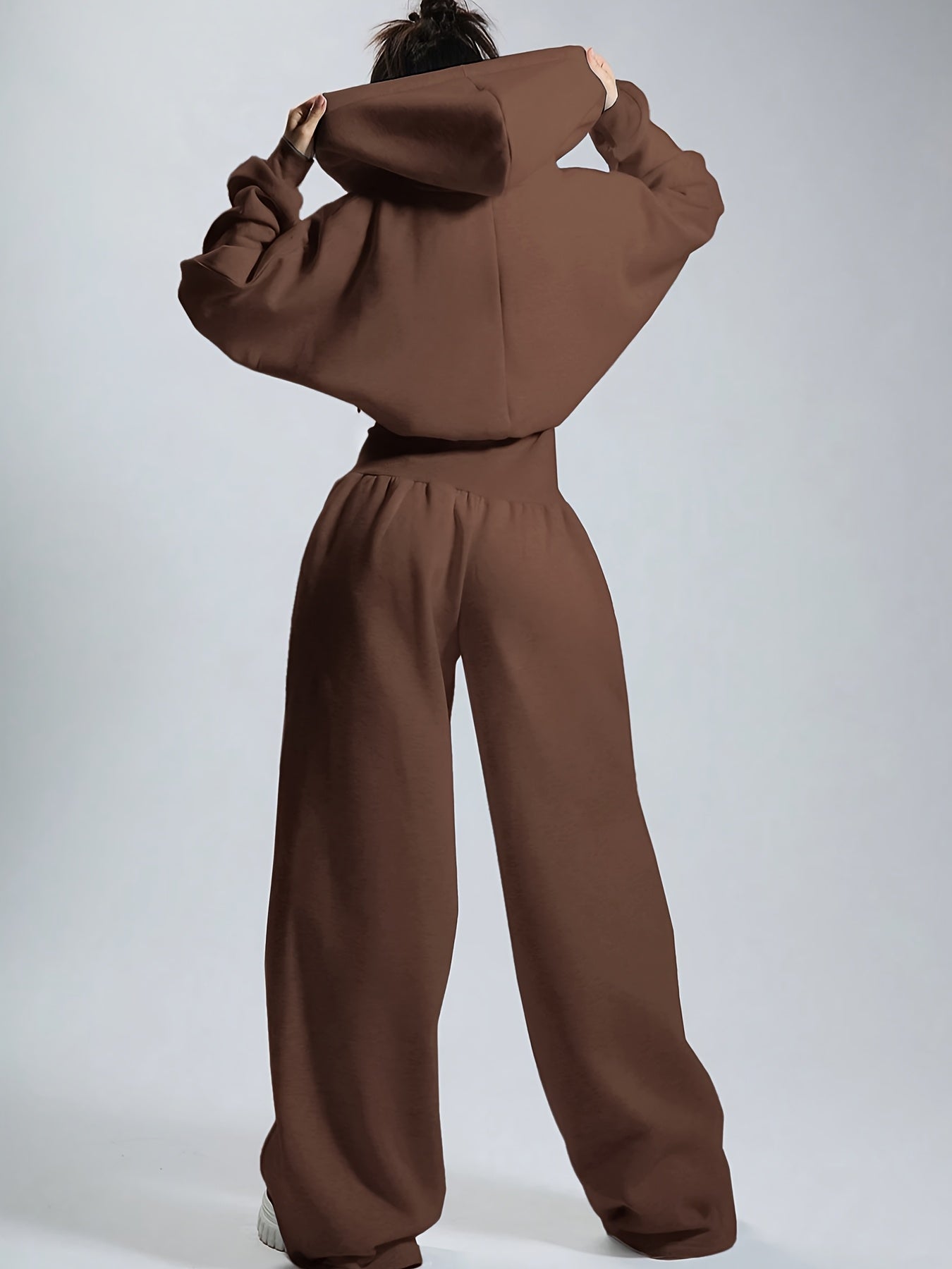 Women's jumpsuit with hood, long sleeves, wide legs, and zipper