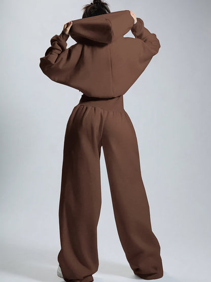 Women's jumpsuit with hood, long sleeves, wide legs, and zipper