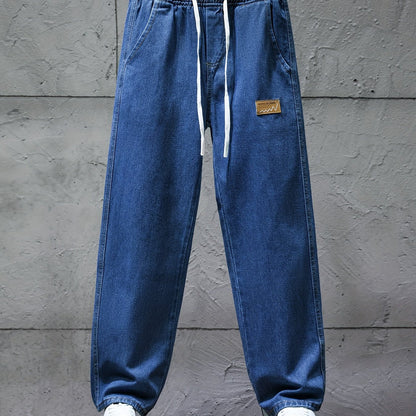 Dark blue jeans with an elastic waistband and drawstring