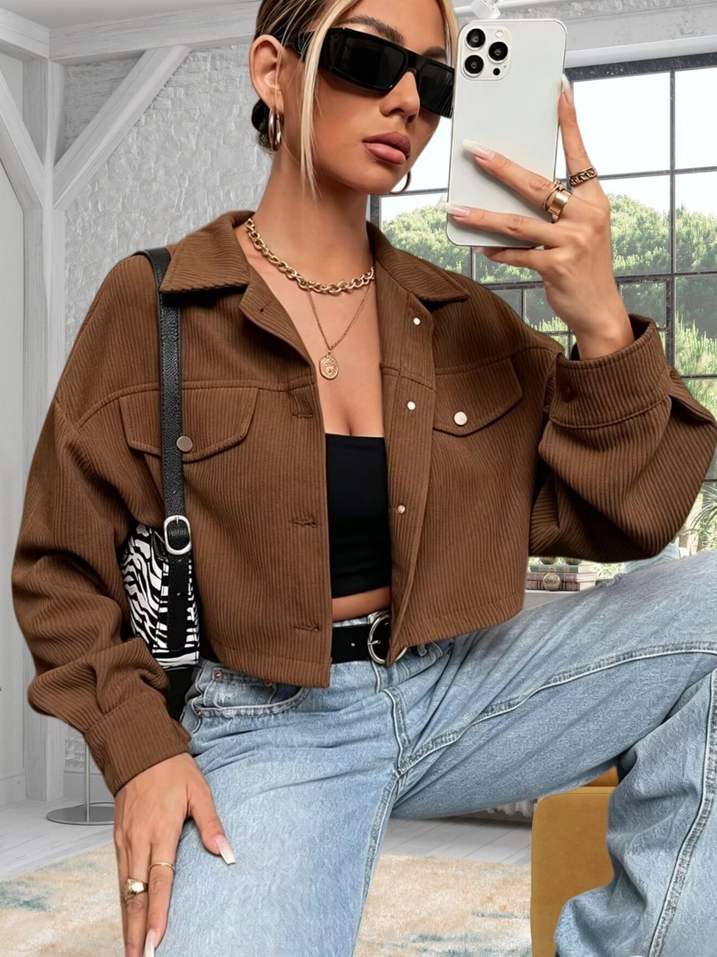 Short women's corduroy jacket with a collar and chest pockets