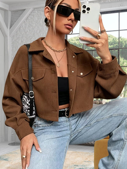 Short women's corduroy jacket with a collar and chest pockets