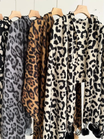Leopard-print scarf with pom-poms