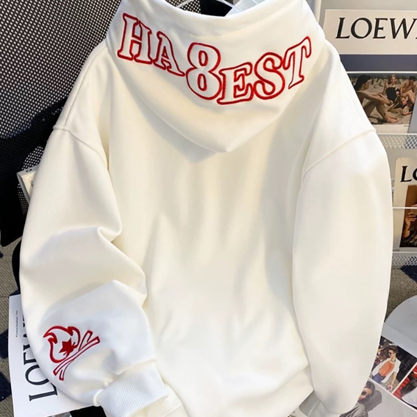 White hooded sweatshirt with red embroidery