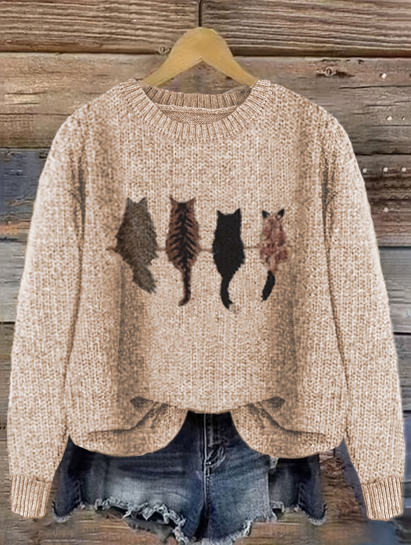 Women's knitted sweater with round neckline and cat motif