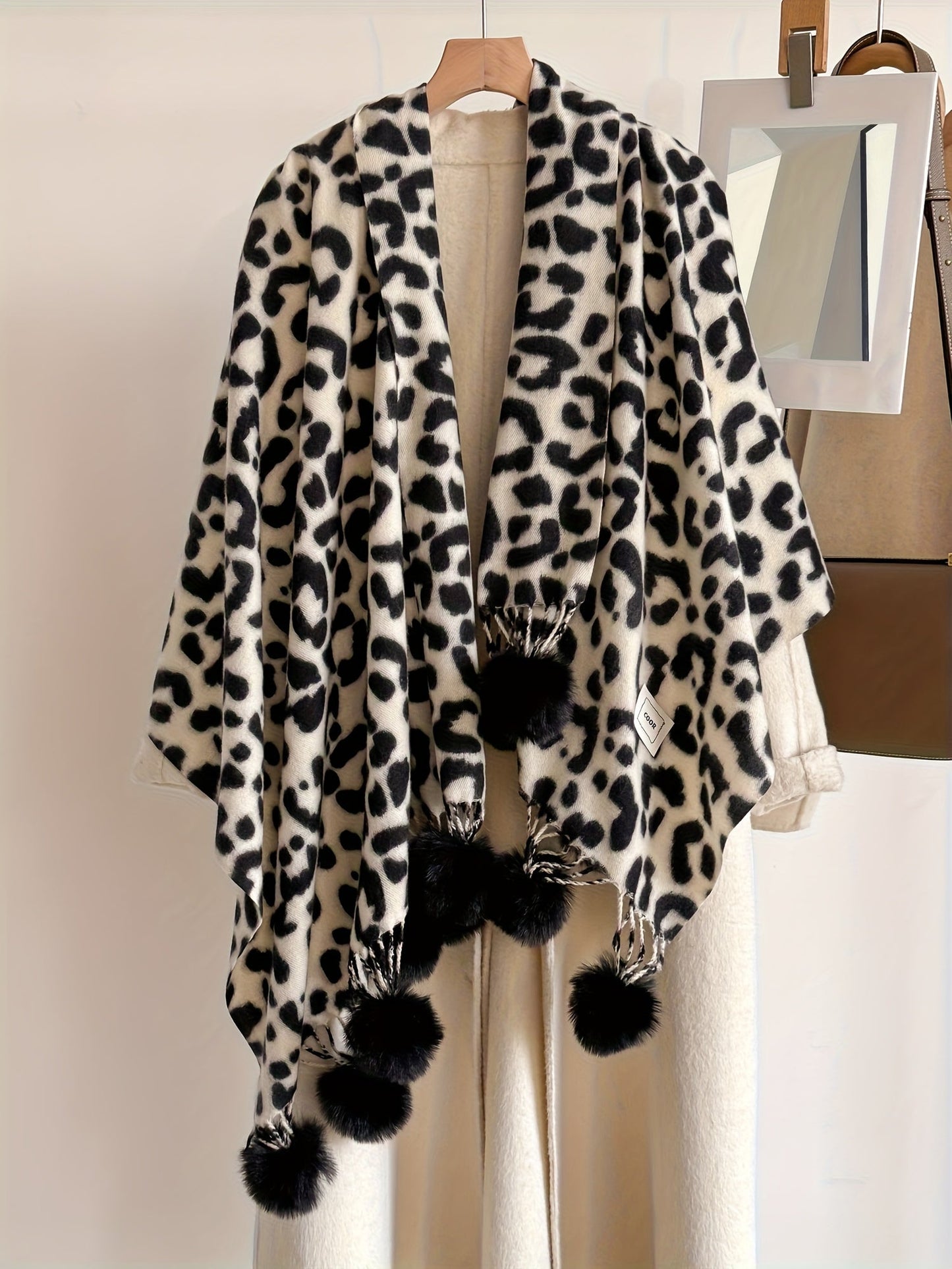 Leopard-print scarf with pom-poms