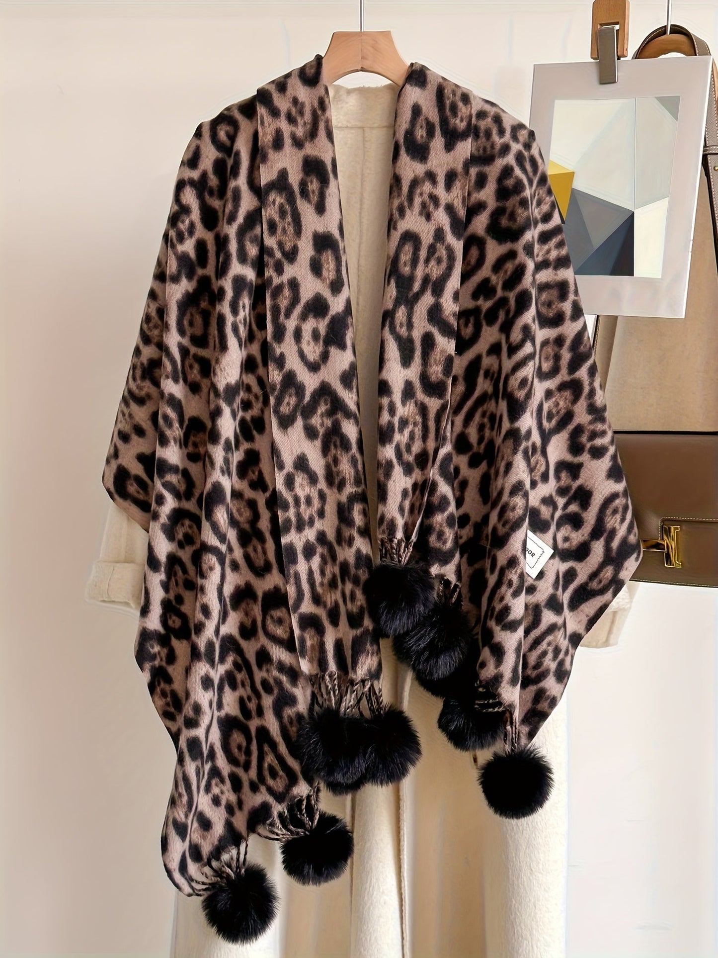 Leopard-print scarf with pom-poms