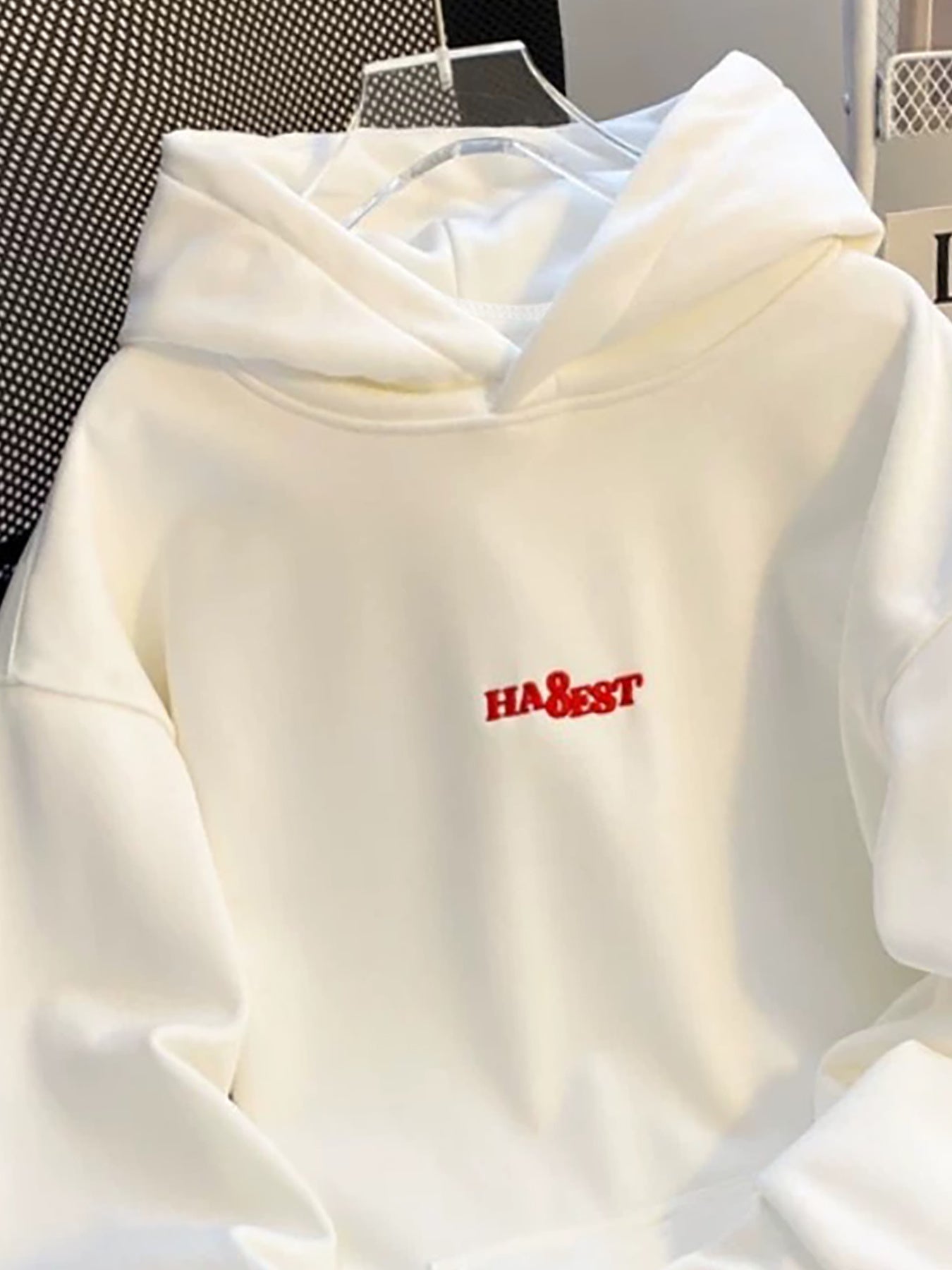 White hooded sweatshirt with red embroidery