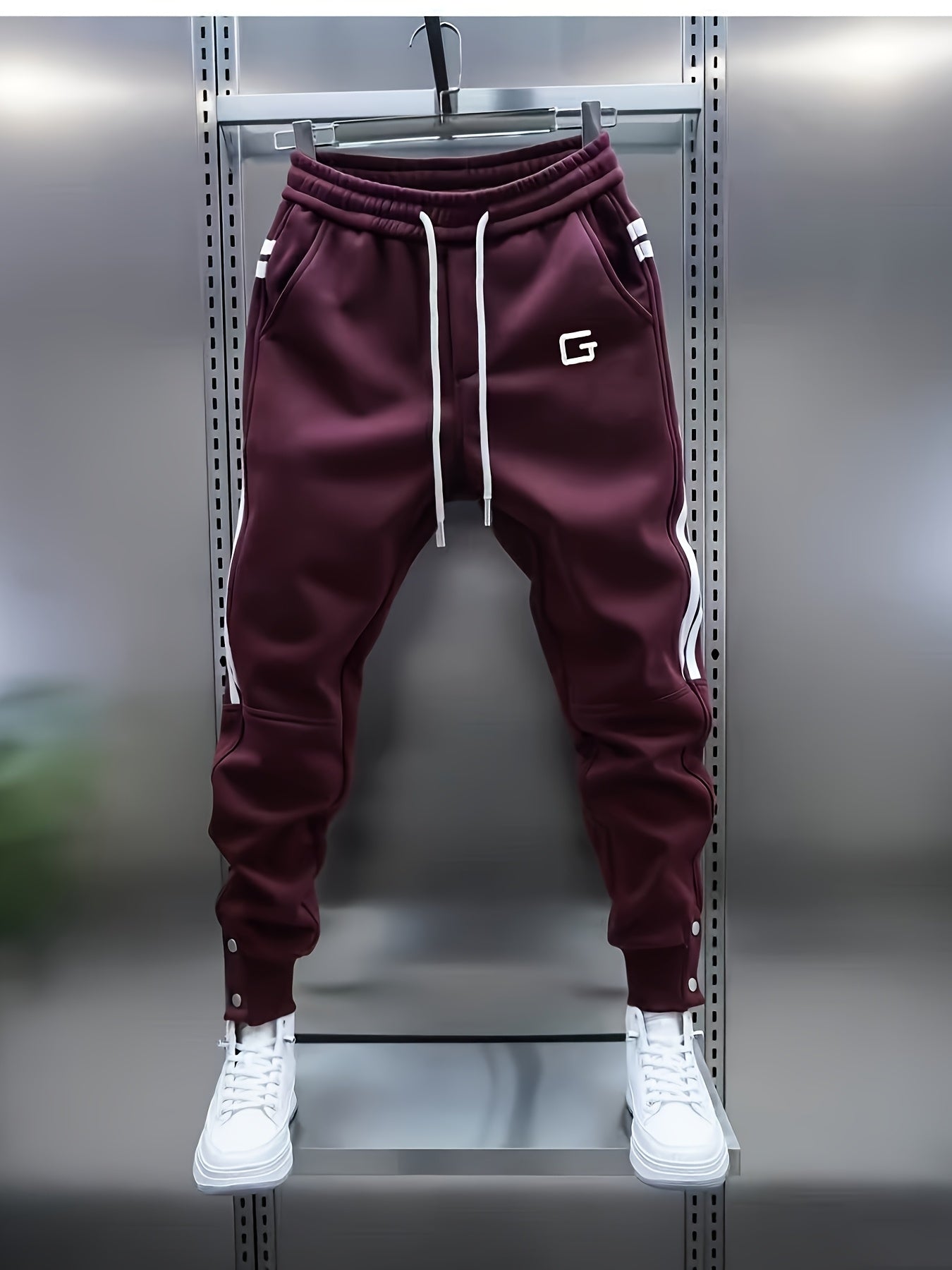 Men's sporty joggers with drawstring, stripes, and buttons