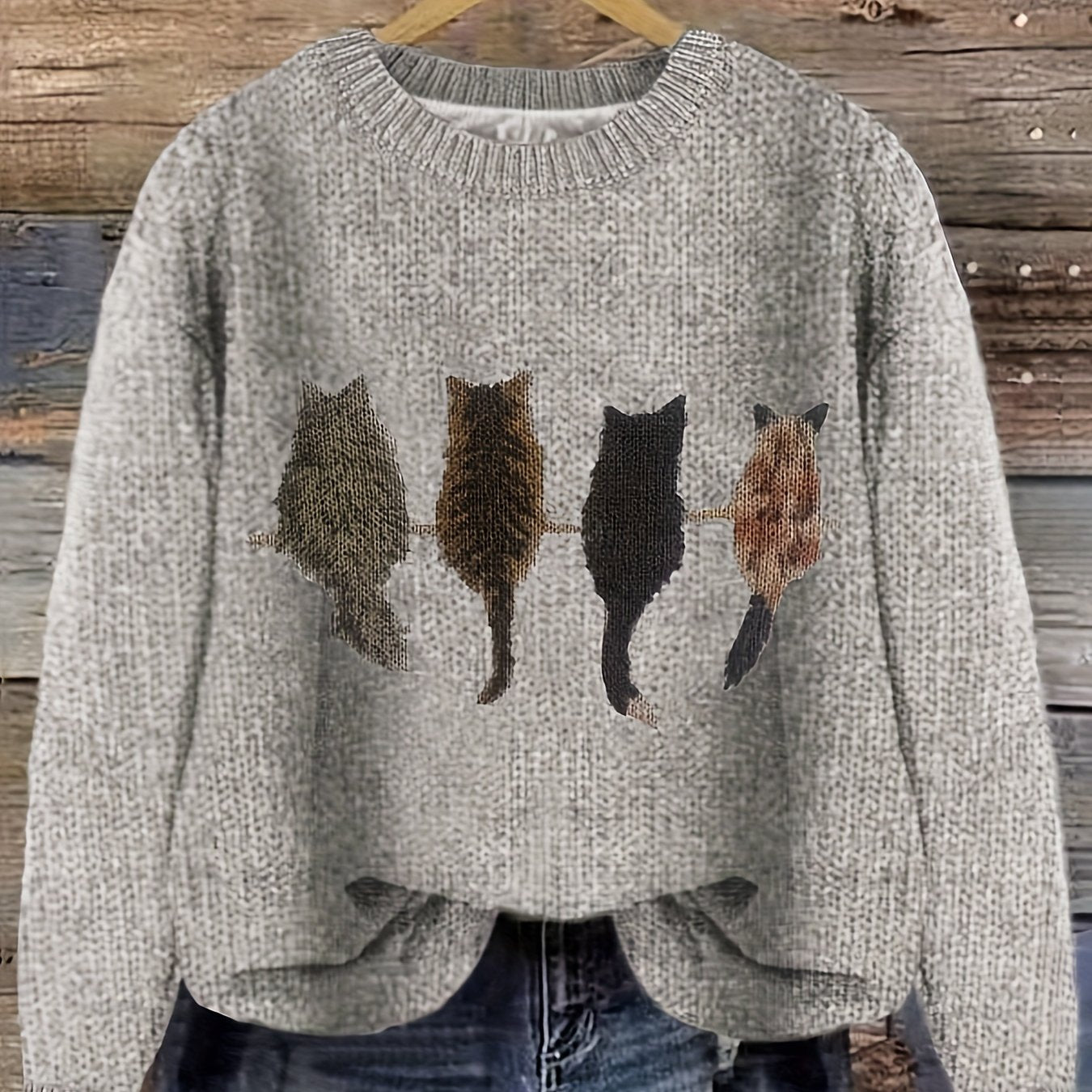 Women's knitted sweater with round neckline and cat motif