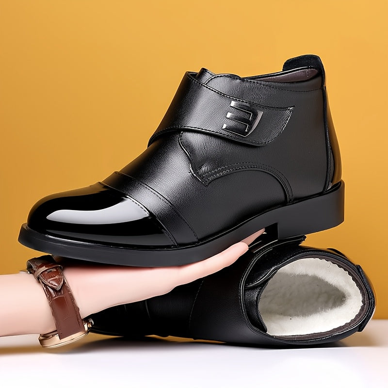 Black men’s slip-on ankle boots with a polished toe cap and Velcro fastening