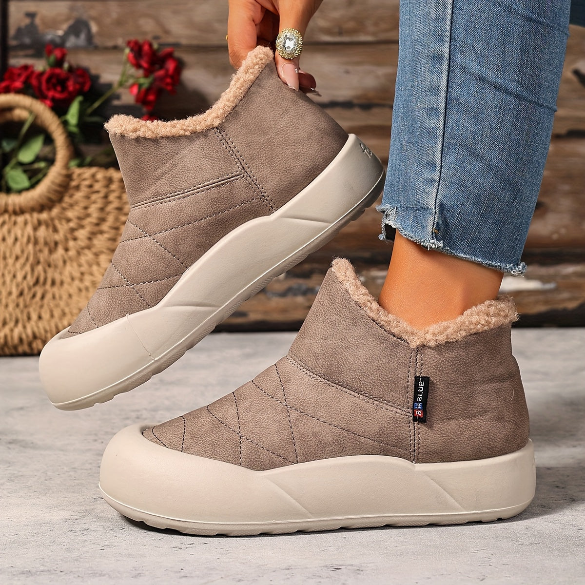 Lined gray ankle boots with quilted uppers and beige plush lining