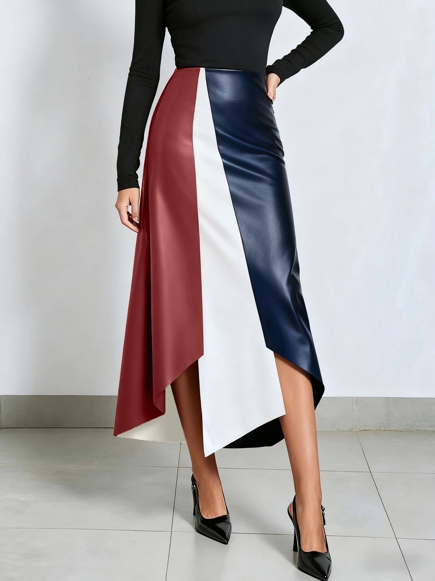 Color-block midi skirt with an asymmetrical faux-leather hem