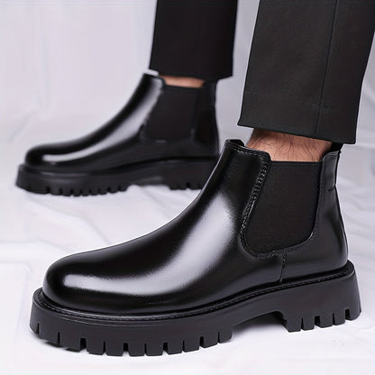 Black Chelsea boots with elastic panels and a lug sole