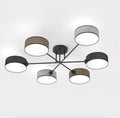 Zesarmige plafondlamp met zwart frame en cilindrische geweven kappen in zwart, bruin en grijs