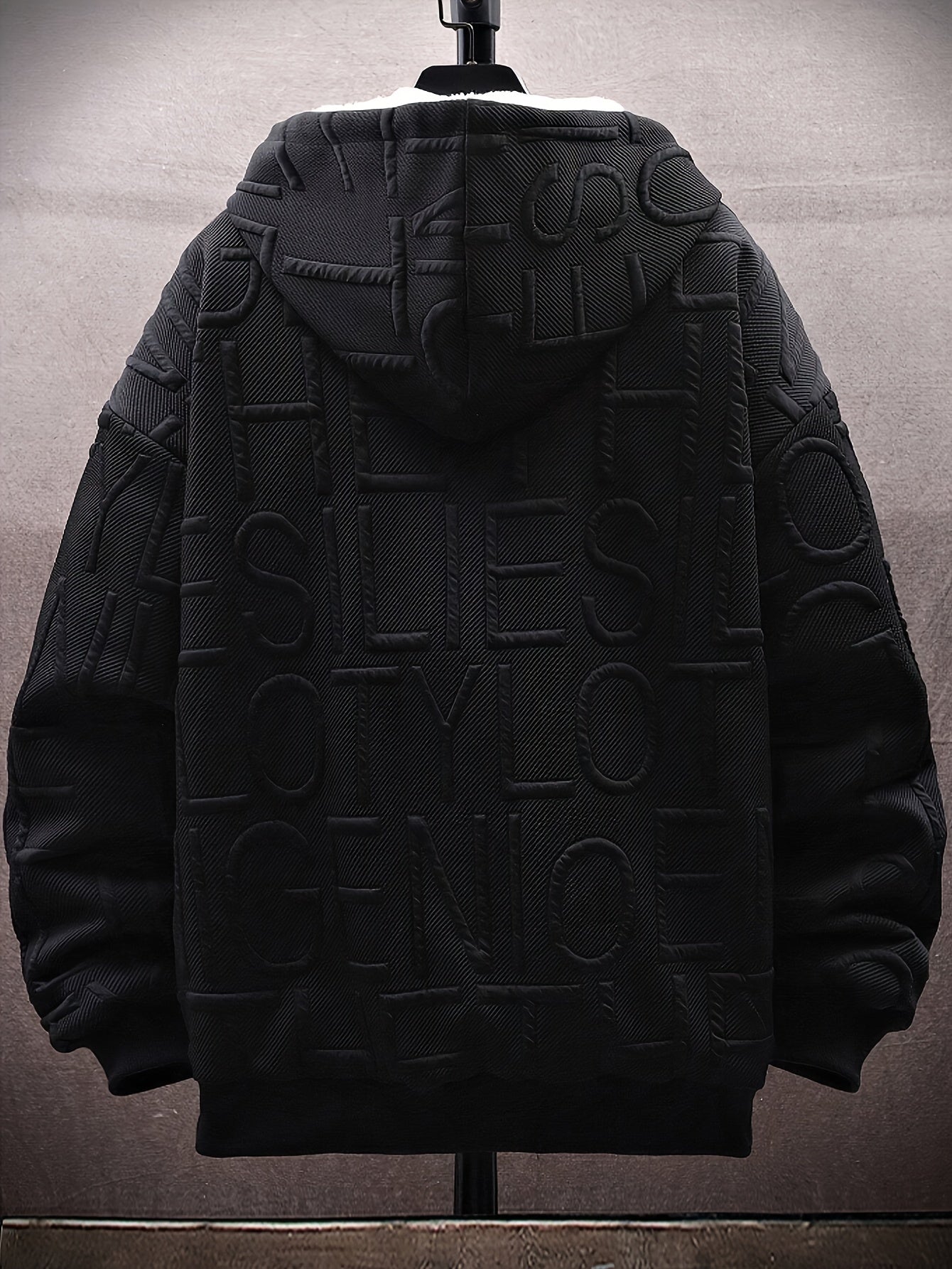 Unisex hooded jacket with fleece lining and raised lettering, zipper, kangaroo pockets, in black