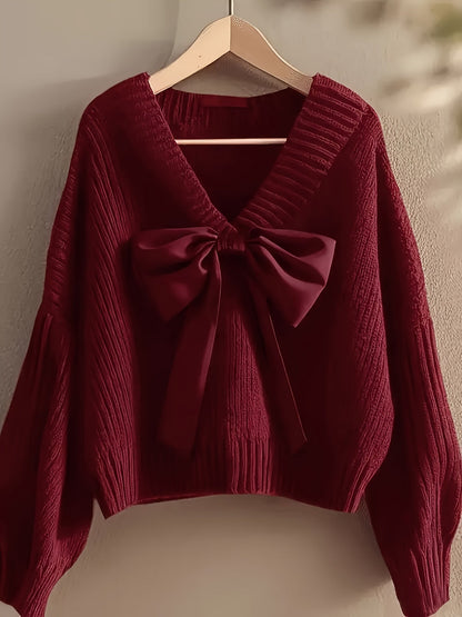 Women's ribbed long-sleeve V-neck sweater with a large bow