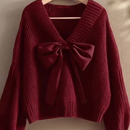 Women's ribbed long-sleeve V-neck sweater with a large bow
