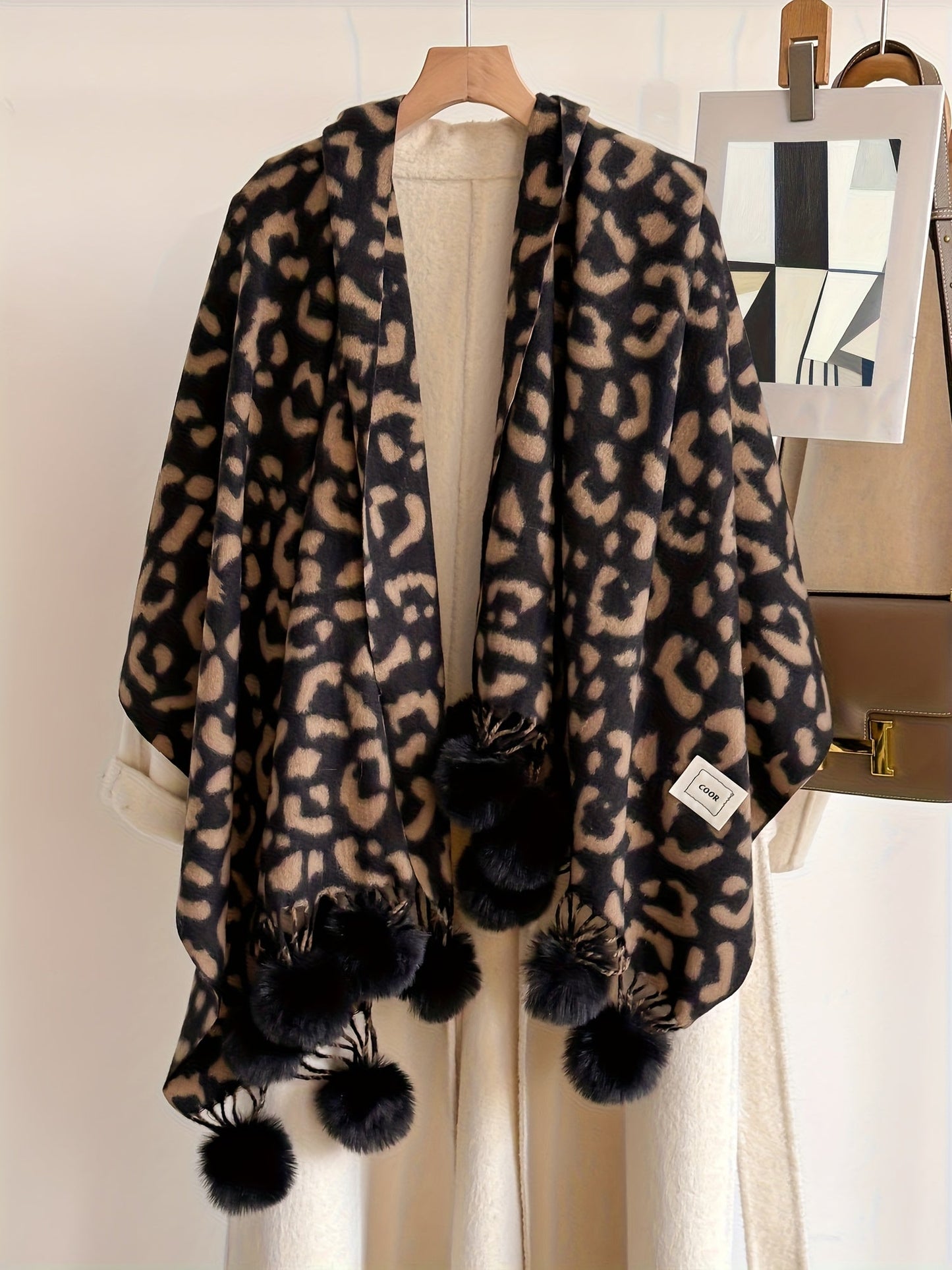 Leopard-print scarf with pom-poms