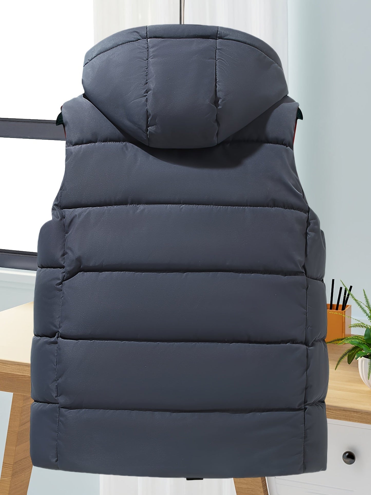 Unisex hooded quilted vest with a zipper and pockets