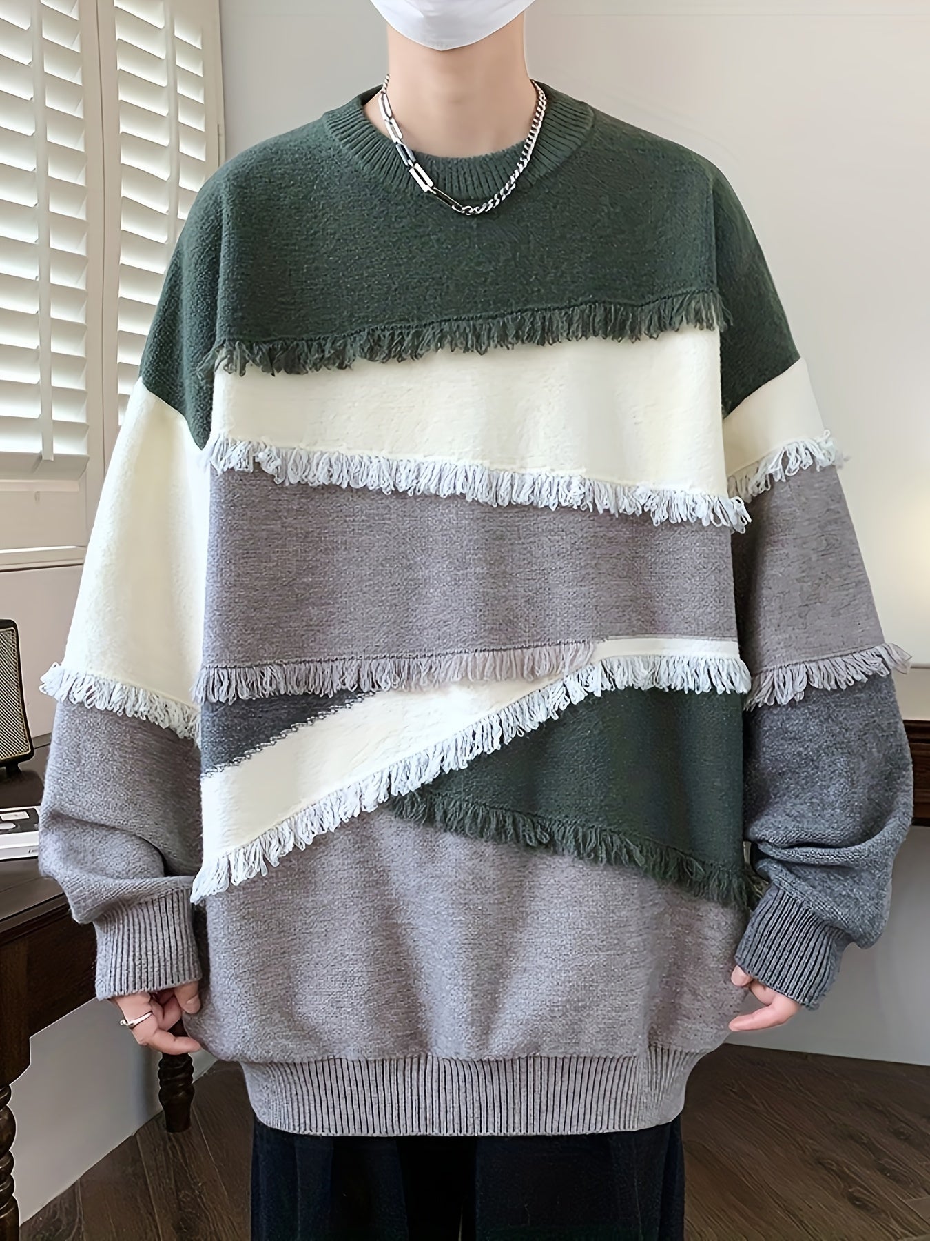 Unisex long-sleeve pullover with color-block design, fringe, and crew neck