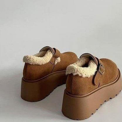 Brown platform moccasins with fur lining and buckle