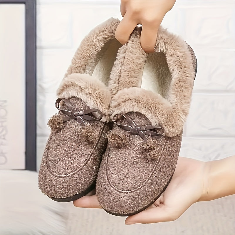 Women's black plush slippers with a bow