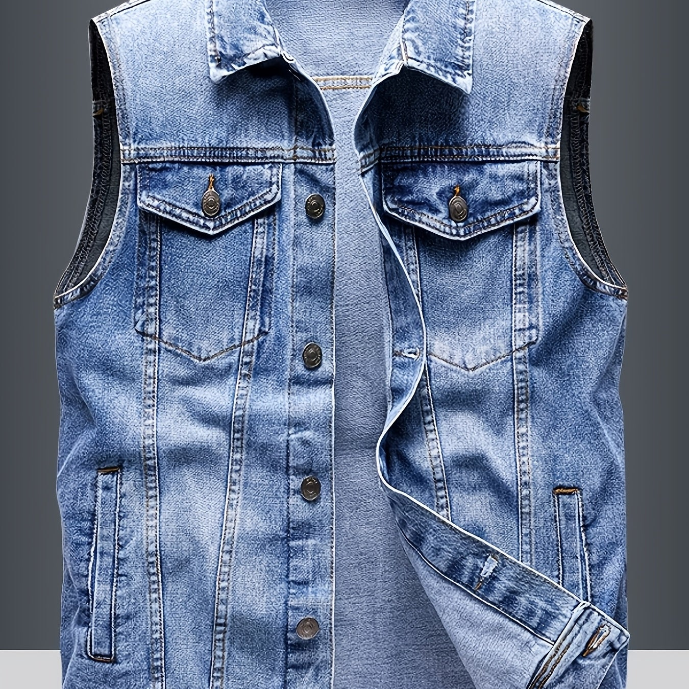 Men's blue sleeveless denim vest with button closure and chest pockets
