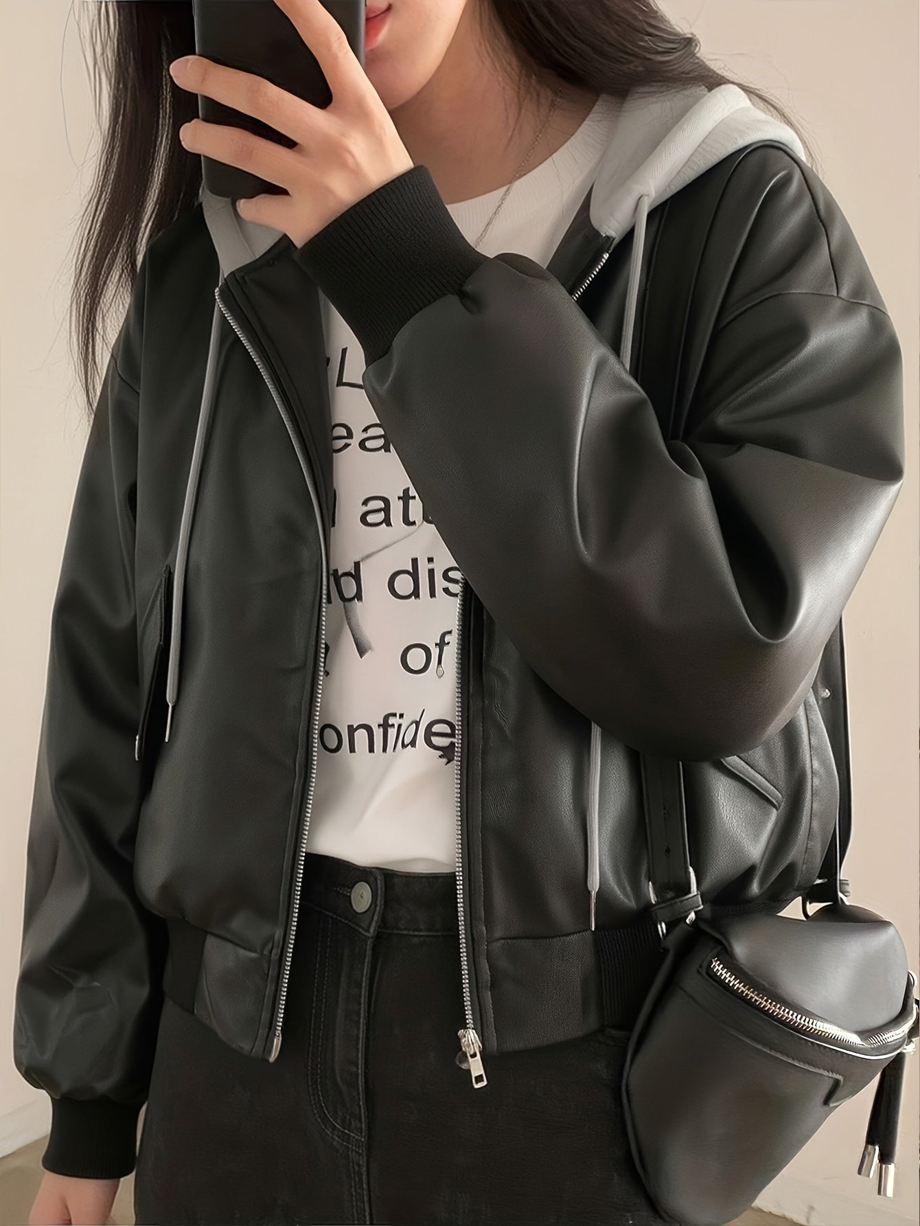 Unisex black bomber jacket with hood made of soft material