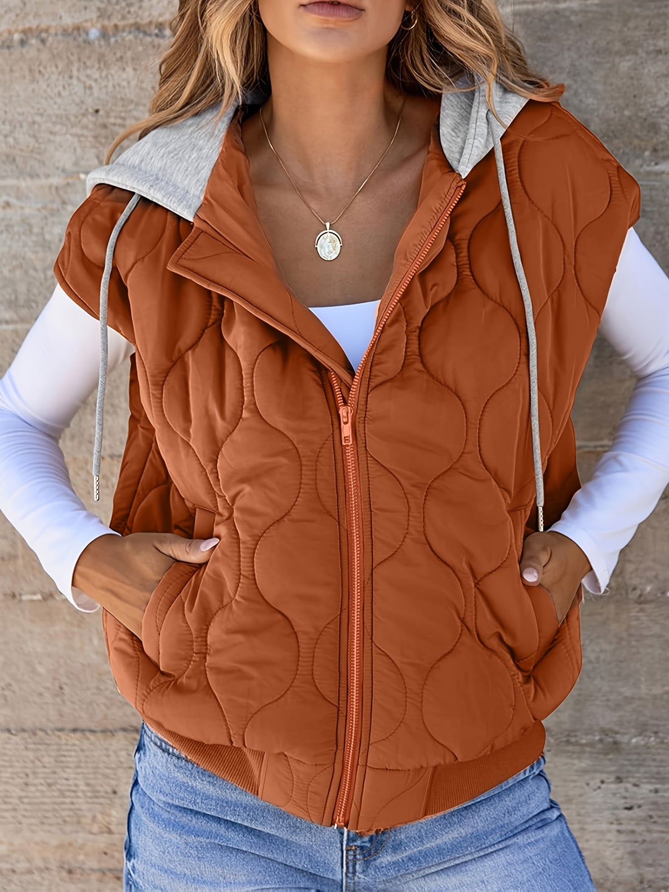 Women's quilted vest with hood in rust brown