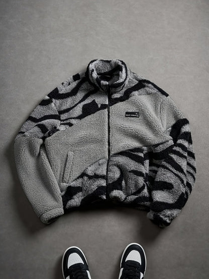 Unisex fleece jacket with stand-up collar, zipper, and animal print