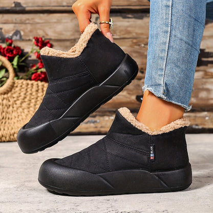 Lined gray ankle boots with quilted uppers and beige plush lining