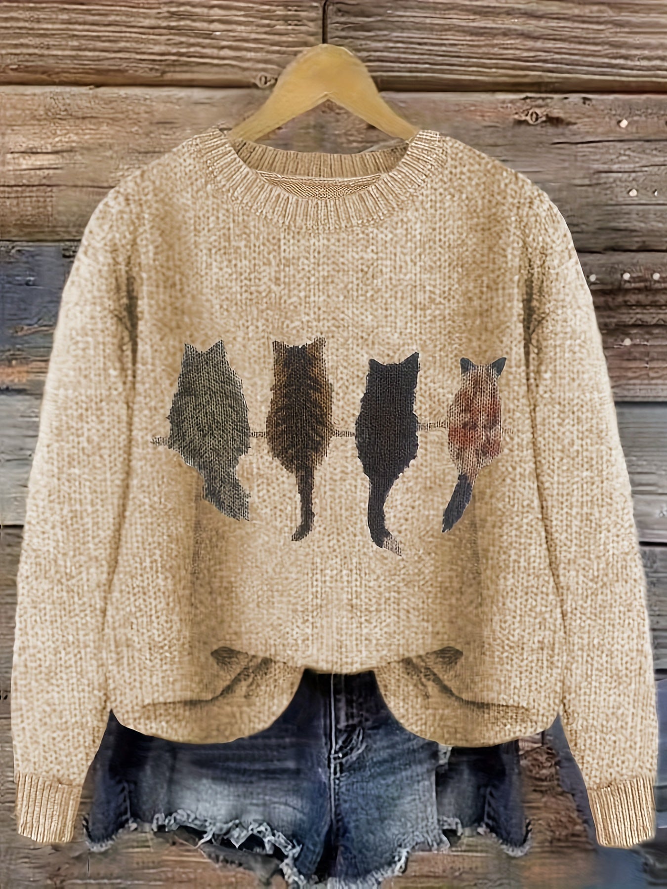 Women's knitted sweater with round neckline and cat motif