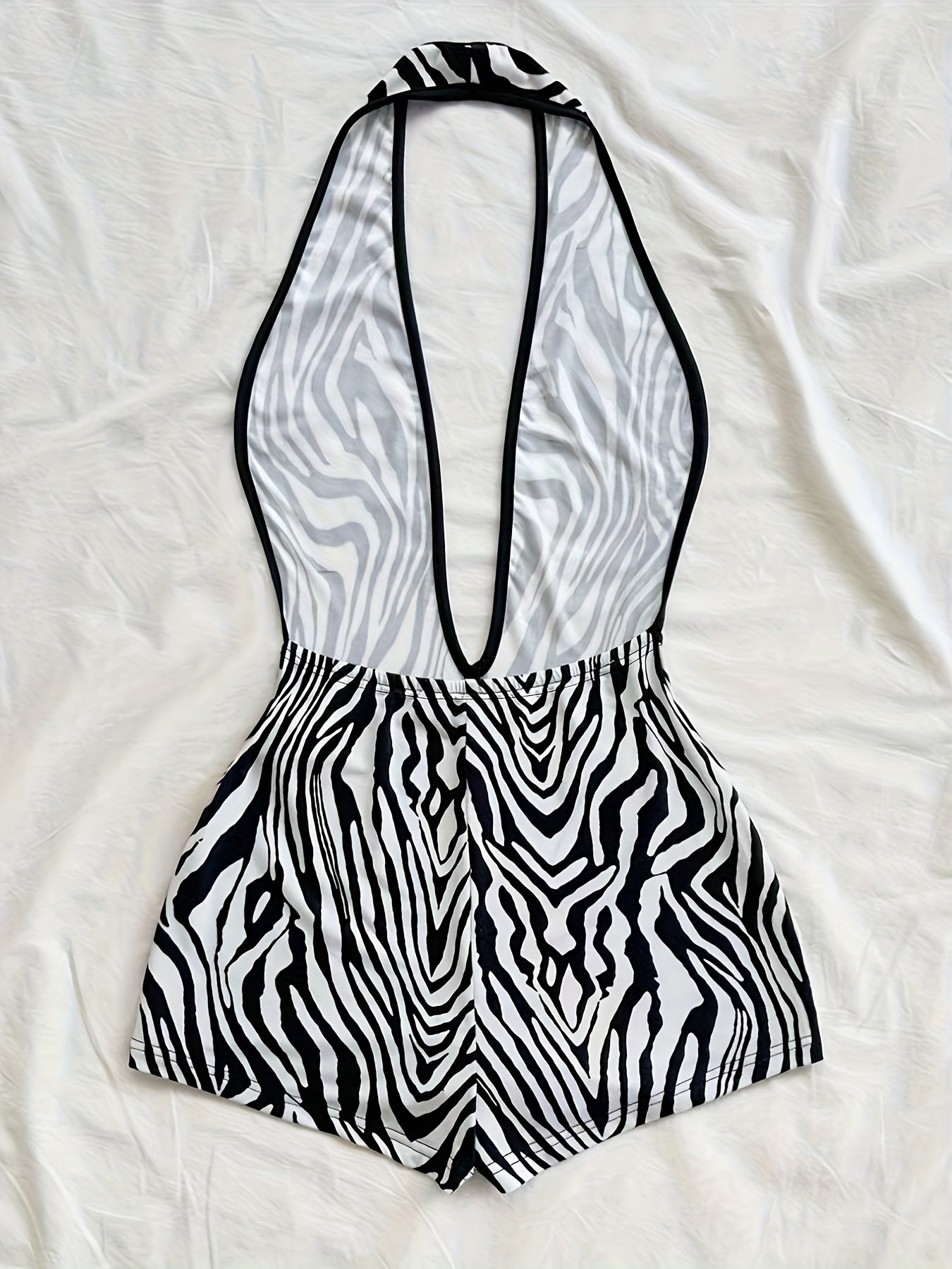 Women's jumpsuit with animal print and deep neckline – fashionable one-piece for summer, beach & party