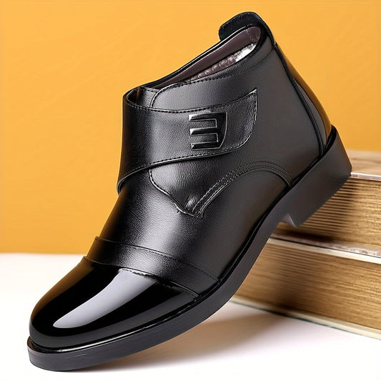 Black men’s slip-on ankle boots with a polished toe cap and Velcro fastening