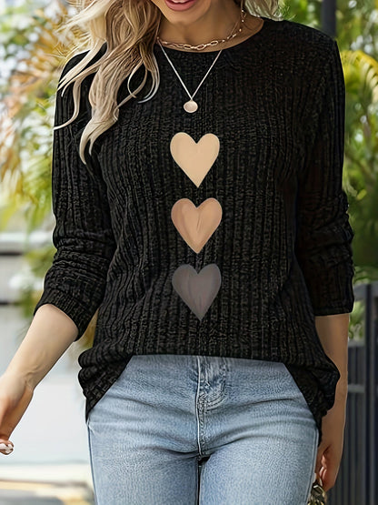 Women's black long-sleeve shirt with heart appliqués