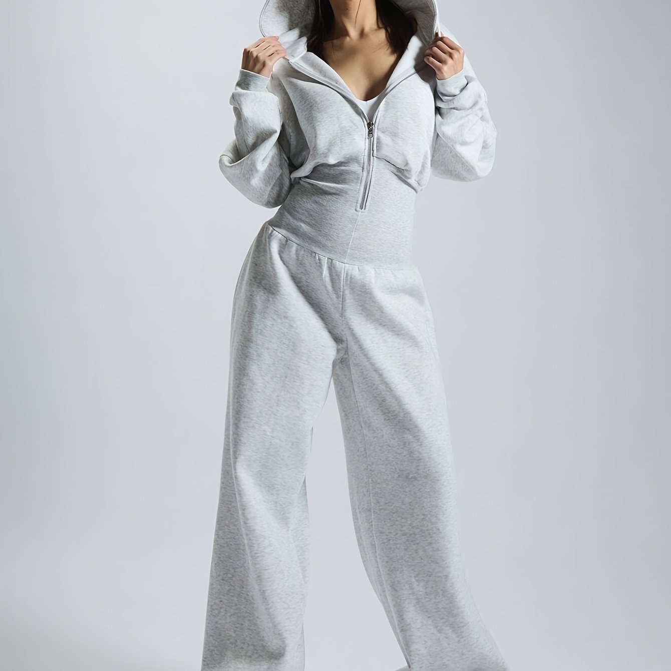 Women's jumpsuit with hood, long sleeves, wide legs, and zipper