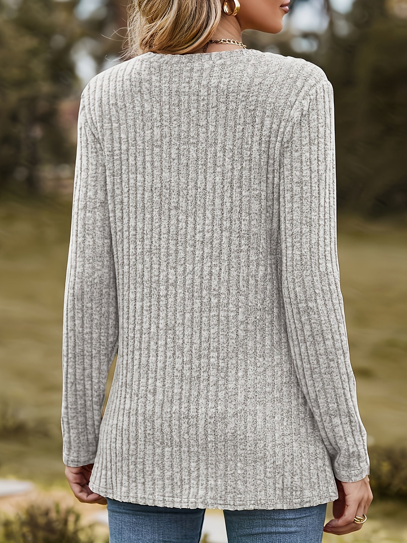 Women's black long-sleeve shirt with heart appliqués