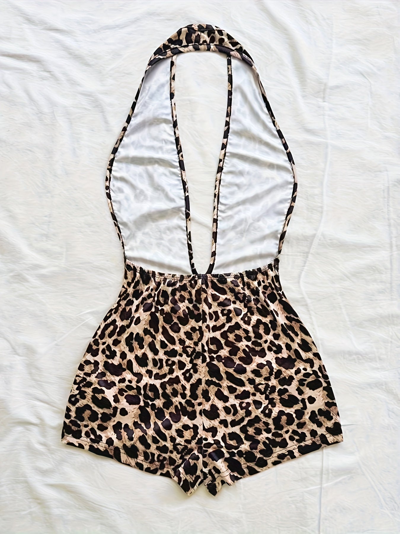 Women's jumpsuit with animal print and deep neckline – fashionable one-piece for summer, beach & party