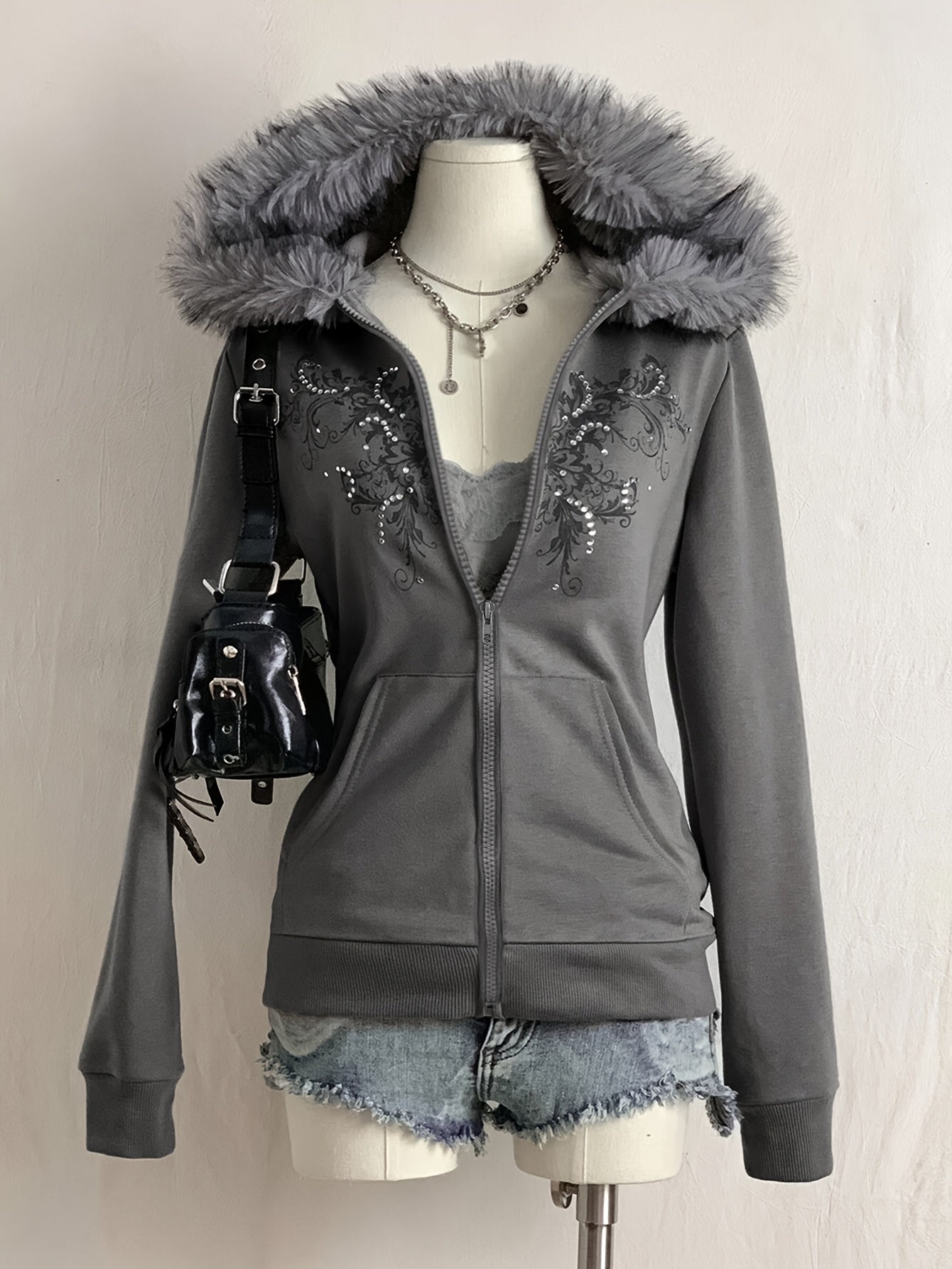 Women's hooded zip-up jacket with faux fur trim and a decorative pattern in gray