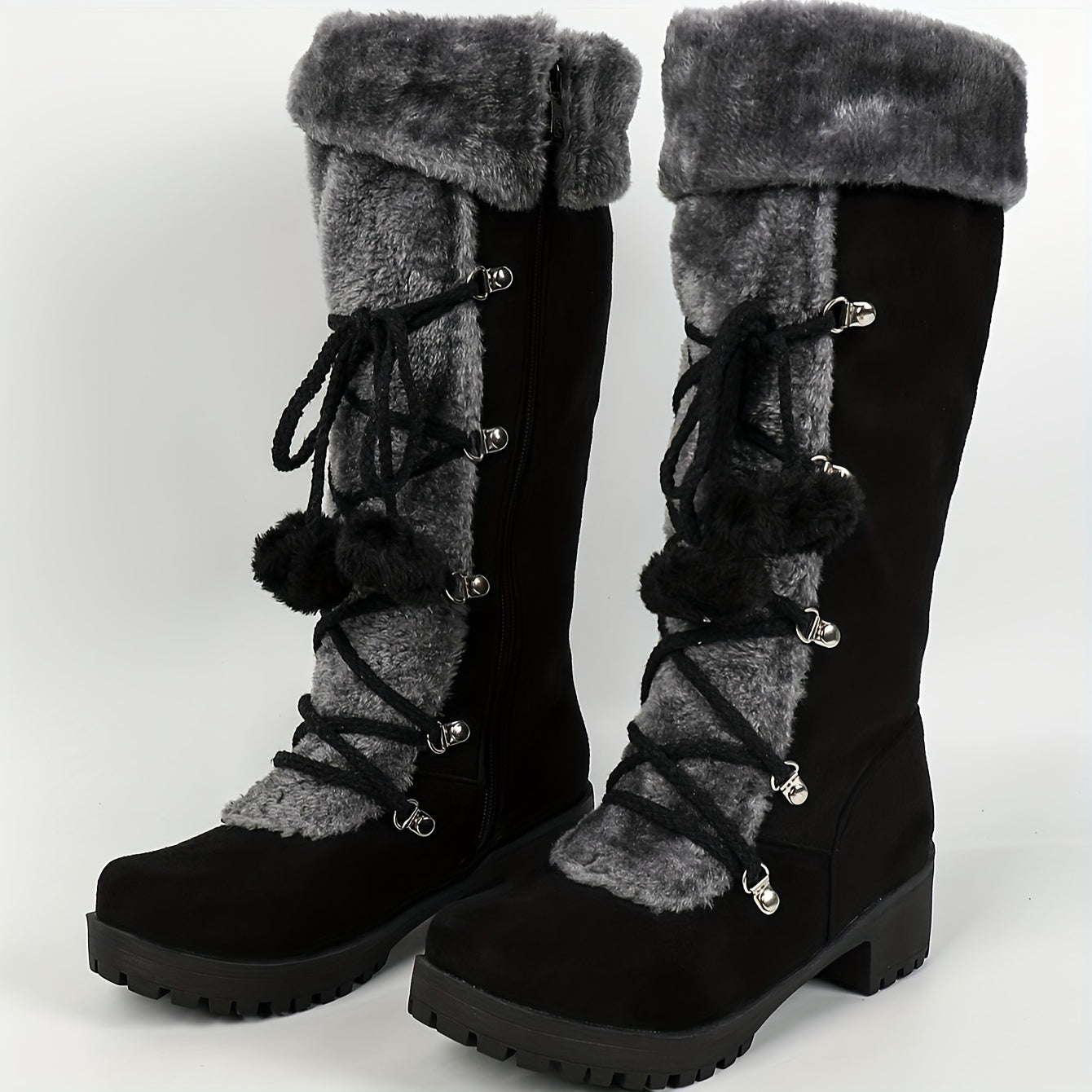 Women's black winter boots with plush trim, laces, and a zipper