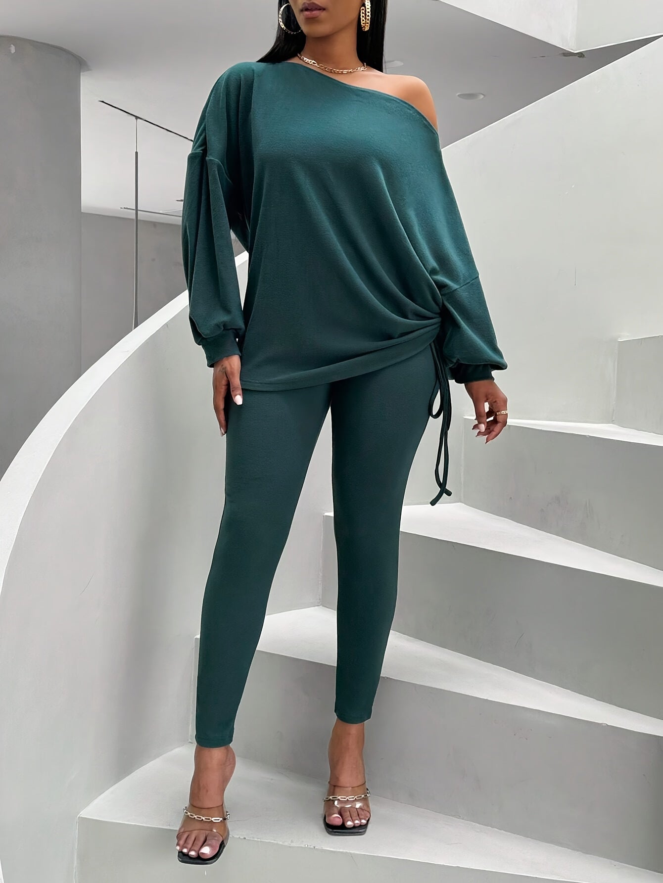 Women's dark green two-piece set with an off-shoulder top and leggings