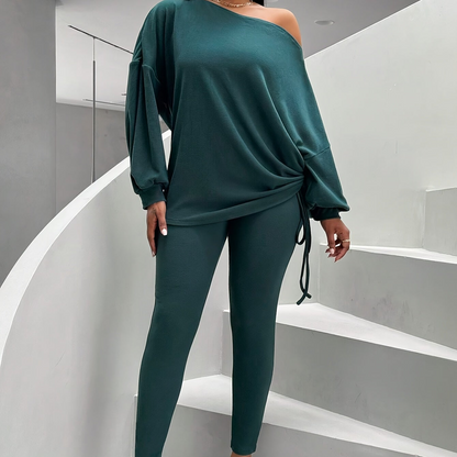 Women's dark green two-piece set with an off-shoulder top and leggings