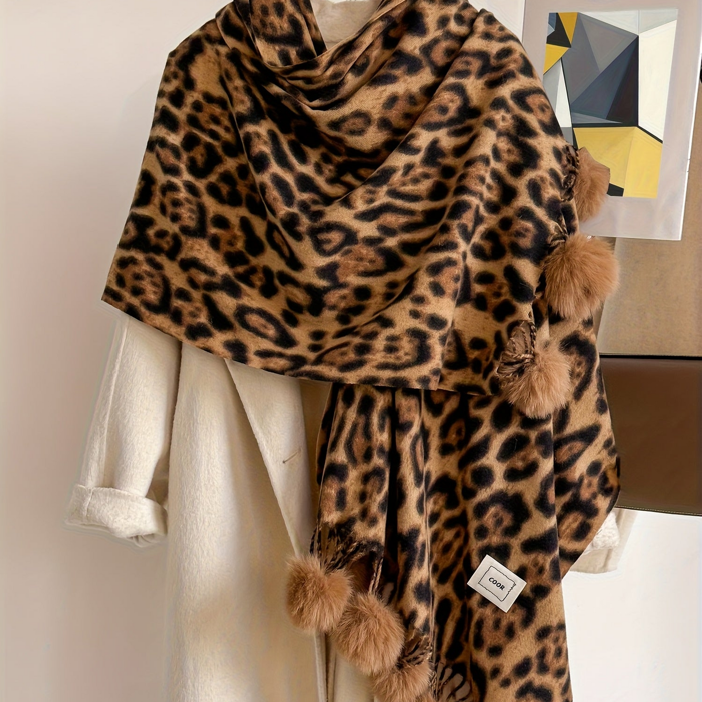 Leopard-print scarf with pom-poms