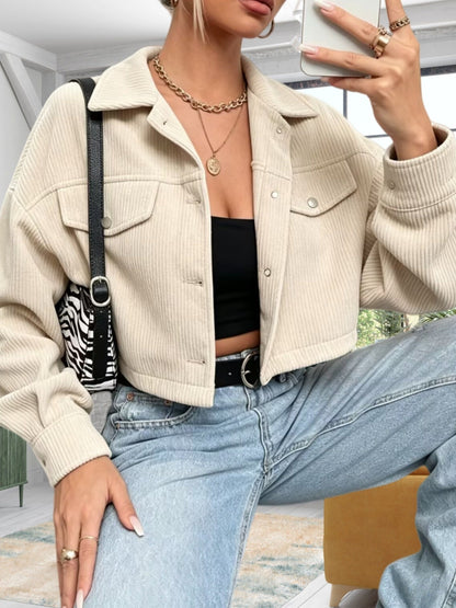 Short women's corduroy jacket with a collar and chest pockets