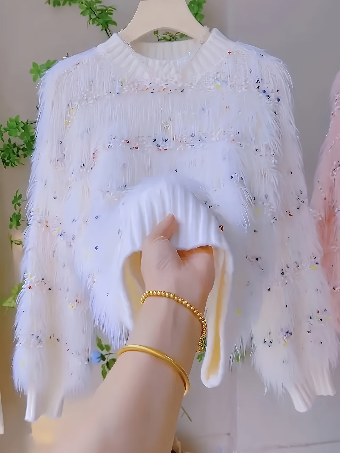 White fluffy pullover with colorful accents